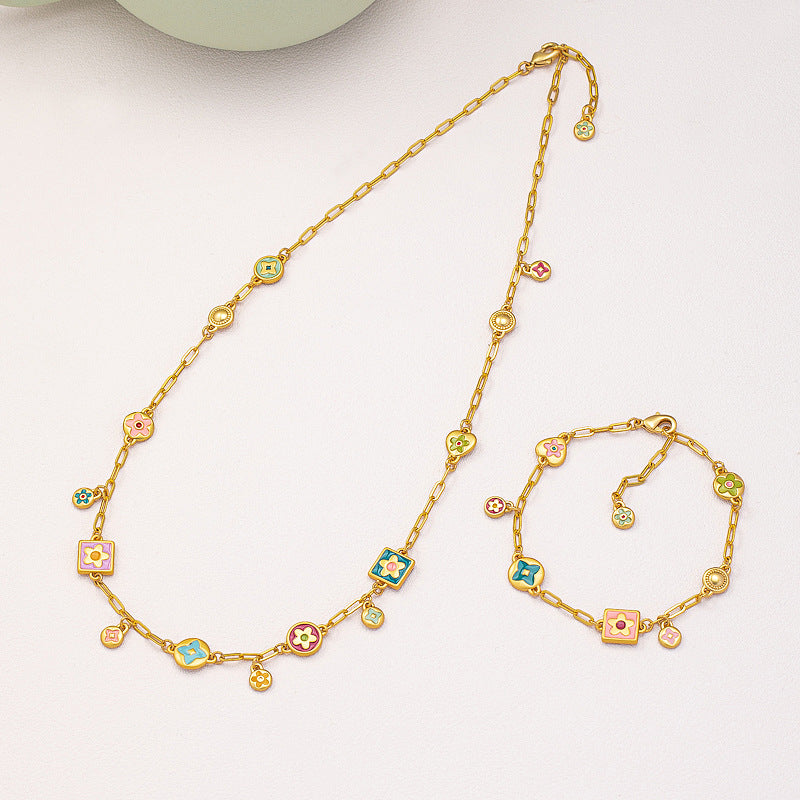 Colorful  Stainless steel jewelry enamel double-sided dopamine bracelet with pastel flower and heart charms on a gold paperclip chain.