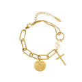 Cross charm pearl bead and engraved quote disc paperclip chain stainless steel jewelry bracelet in waterproof 18k gold plated finish.