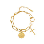 Cross charm pearl bead and engraved quote disc paperclip chain stainless steel jewelry bracelet in waterproof 18k gold plated finish.