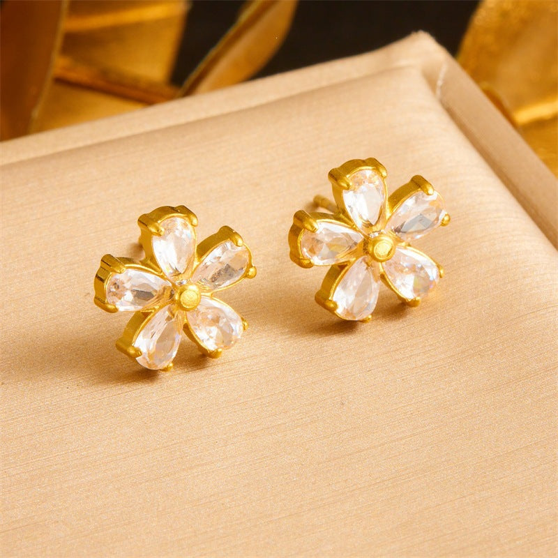 Marquise cut cubic zirconia cz crystal five petal flower stud earrings stainless steel jewelry in waterproof 18k gold plated finish.
