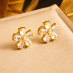 Marquise cut cubic zirconia cz crystal five petal flower stud earrings stainless steel jewelry in waterproof 18k gold plated finish.