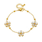 Marquise cut cubic zirconia cz crystal five petal flower stud earrings stainless steel jewelry in waterproof 18k gold plated finish.