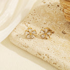 Marquise cut cubic zirconia cz crystal five petal flower stud earrings stainless steel jewelry in waterproof 18k gold plated finish.