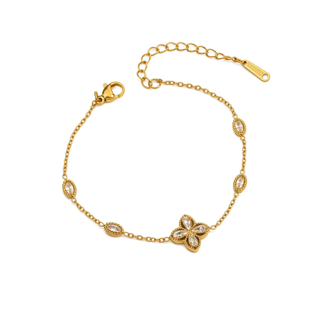 Cubic zirconia cz four petal flower pendant and oval bezel stations cable chain stainless steel jewelry bracelet in waterproof 18k gold plated finish.