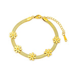 Daisy flower charm stations flat snake link chain stainless steel jewelry bracelet in waterproof 18k gold plated finish.