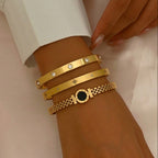Round disc shell inlay and watch-band link mesh style stainless steel jewelry bangle in waterproof 18k gold plated finish.