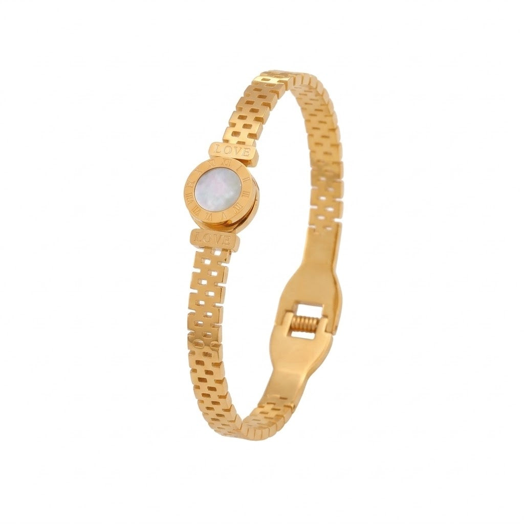 Round disc shell inlay and watch-band link mesh style stainless steel jewelry bangle in waterproof 18k gold plated finish.