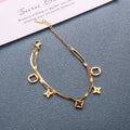 Double layer flat snake chain and cable link with clover motifs and geometric charms stainless steel jewelry bracelet in waterproof 18k gold plated finish.