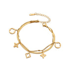 Double layer flat snake chain and cable link with clover motifs and geometric charms stainless steel jewelry bracelet in waterproof 18k gold plated finish.