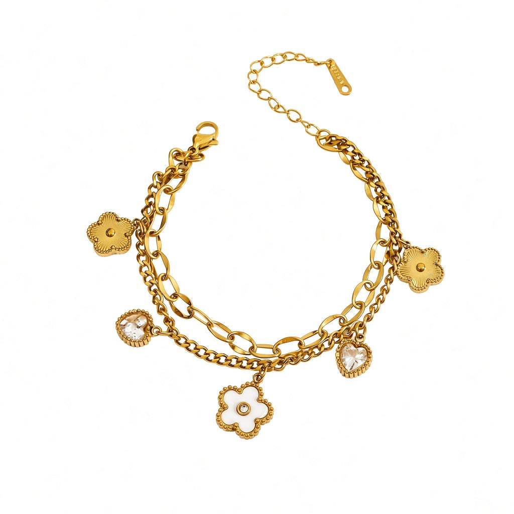 Double layer link chain white shell flower motif and heart cubic zirconia charm stainless steel jewelry bracelet in waterproof 18k gold plated finish.