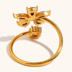 Marquise cubic zirconia cz crystal five petal flower and solitaire round stone open cuff adjustable ring stainless steel jewelry in waterproof 18k gold plated finish.