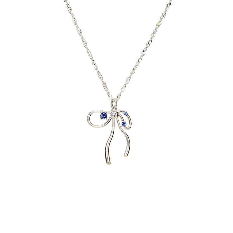 Fluid ribbon bow pendant Singapore twist chain necklace with sparkling crystal accents in 18k gold plated jewelry.