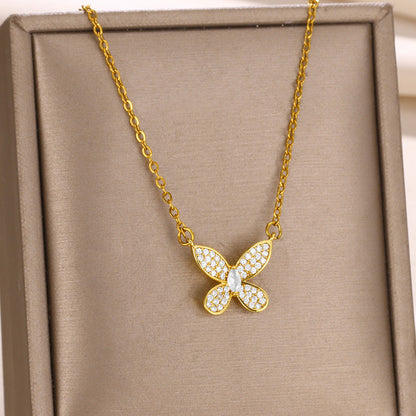 Elegant gold bow pendant necklace featuring a dainty butterfly ribbon design adorned with sparkling zircon accents