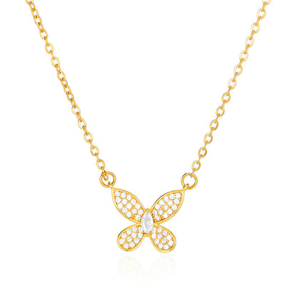 Elegant gold bow pendant necklace featuring a dainty butterfly ribbon design adorned with sparkling zircon accents