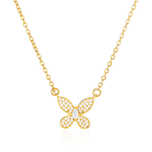 Elegant gold bow pendant necklace featuring a dainty butterfly ribbon design adorned with sparkling zircon accents