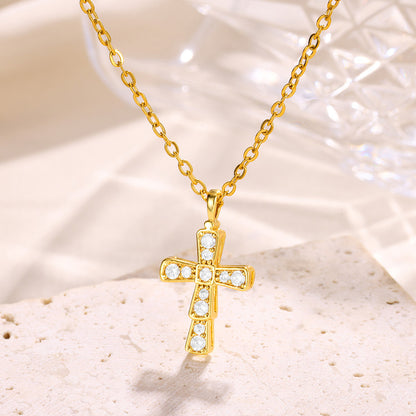 Elegant gold cross pendant necklace featuring brilliant zircon accents in a classic religious starburst design
