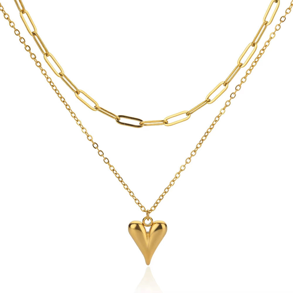 Elegant gold double-layer necklace featuring a minimalist heart pendant on a chic layered delicate chain