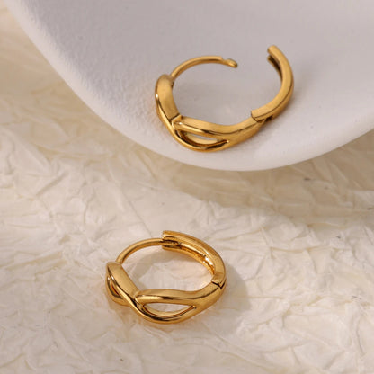 Paired minimalist gold stud earrings featuring a polished infinity symbol design for an elegant, timeless look