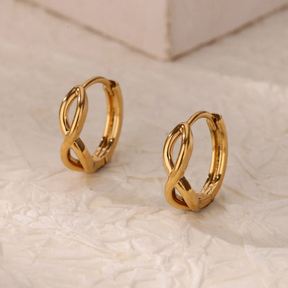 Paired minimalist gold stud earrings featuring a polished infinity symbol design for an elegant, timeless look