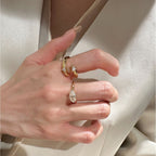 Elegant Gold Stackable Ring featuring a Marquise-cut Zircon centerpiece with Sparkling Pavé Accents on a Wavy Band