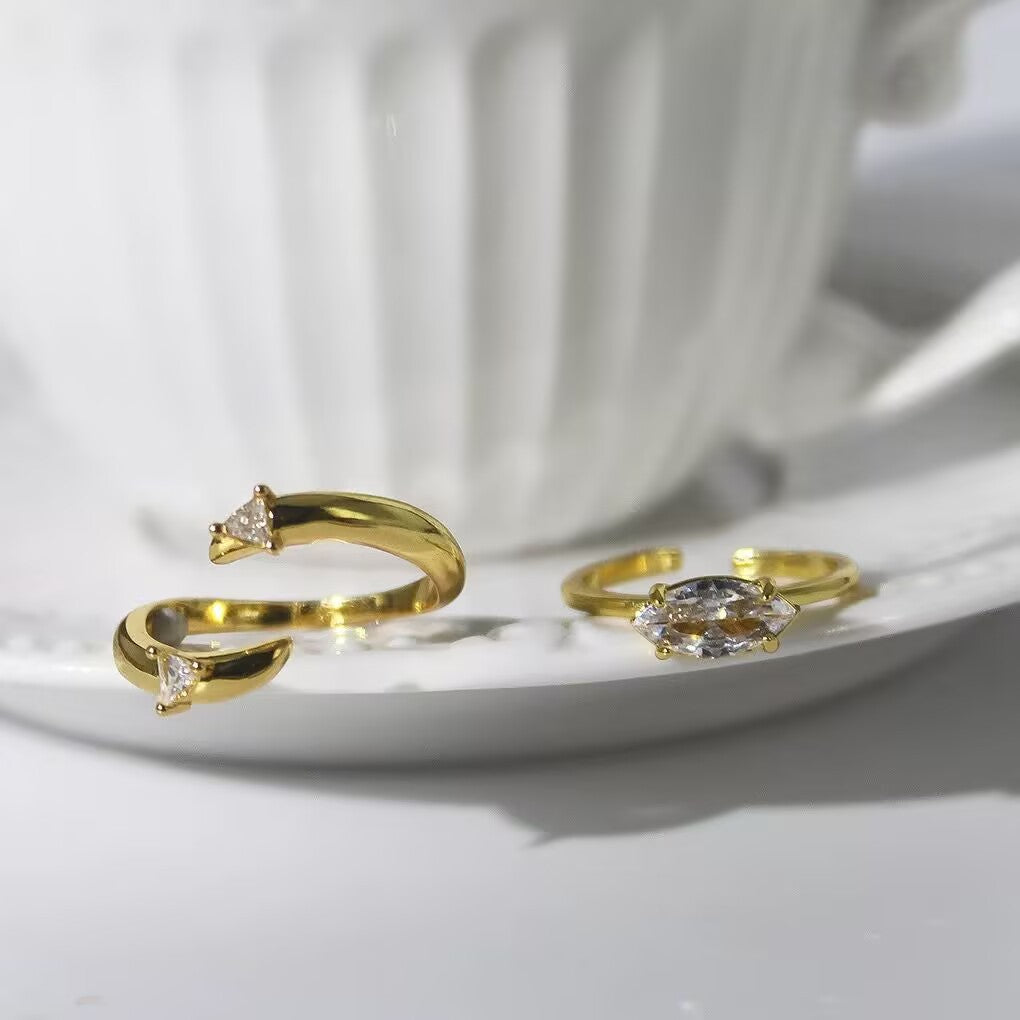Elegant Gold Stackable Ring featuring a Marquise-cut Zircon centerpiece with Sparkling Pavé Accents on a Wavy Band