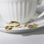 Elegant Gold Stackable Ring featuring a Marquise-cut Zircon centerpiece with Sparkling Pavé Accents on a Wavy Band