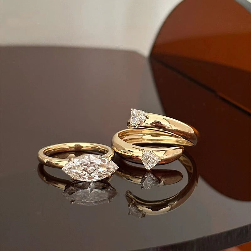 Elegant Gold Stackable Ring featuring a Marquise-cut Zircon centerpiece with Sparkling Pavé Accents on a Wavy Band