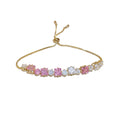 Sparkling gold tennis bracelet featuring multi-color and pink cubic zirconia in a continuous link design