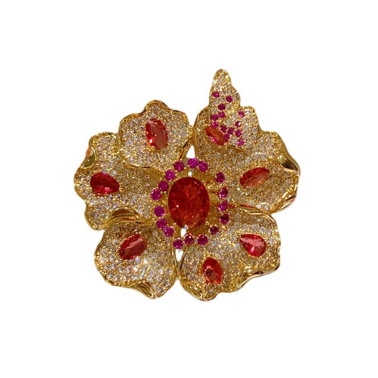 Elegant gold plated double-petal flower brooch featuring sparkling white cubic zirconia in a blooming design