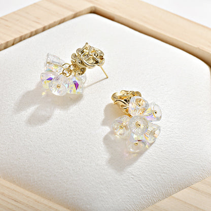 Gold dangle earrings featuring a delicate rose flower top and an intricate hollow bell charm for a vintage look