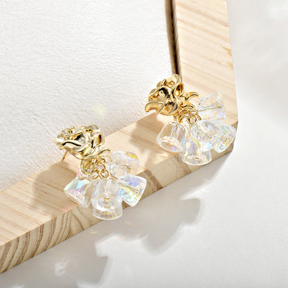 Gold dangle earrings featuring a delicate rose flower top and an intricate hollow bell charm for a vintage look