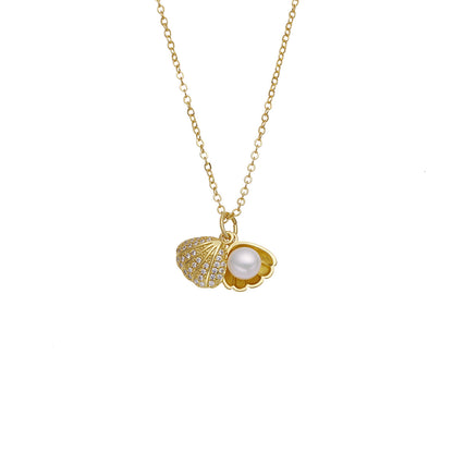 Elegant gold necklace featuring a shell-shaped pendant with a central pearl and shimmering zircon stones on the outer rim