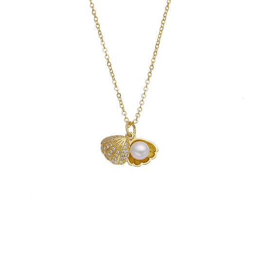 Elegant gold necklace featuring a shell-shaped pendant with a central pearl and shimmering zircon stones on the outer rim