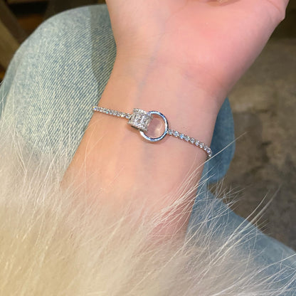 Chic double-layered bracelet featuring cubic zirconia charms, available in gold and silver plated finishes
