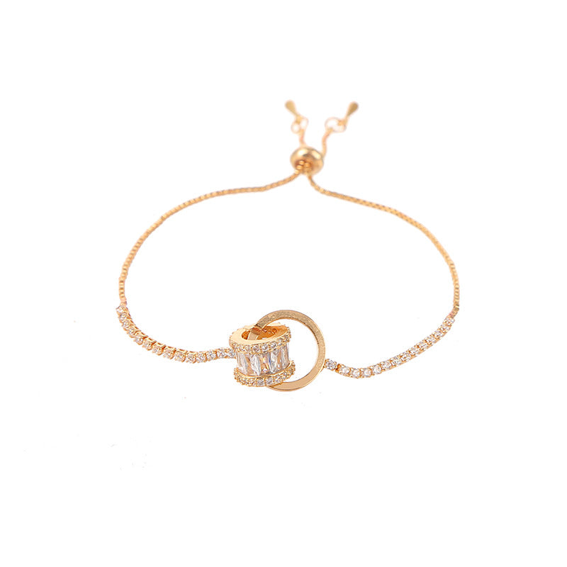 Chic double-layered bracelet featuring cubic zirconia charms, available in gold and silver plated finishes