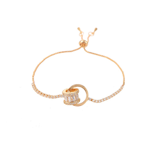 Chic double-layered bracelet featuring cubic zirconia charms, available in gold and silver plated finishes