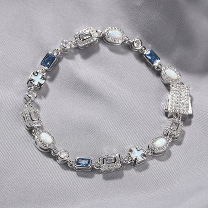 Luxurious halo bracelet with multicolor gemstones and white zirconia, available in gold and silver plated finishes