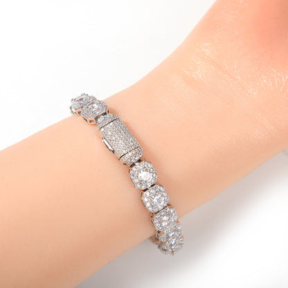 Elegant halo bracelet with a round cubic zirconia center and silver gold plating in a minimalist chain design.