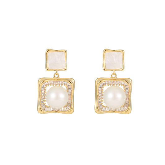 Elegant square zirconia stud earrings with a dangling white pearl charm, available in gold and silver finishe