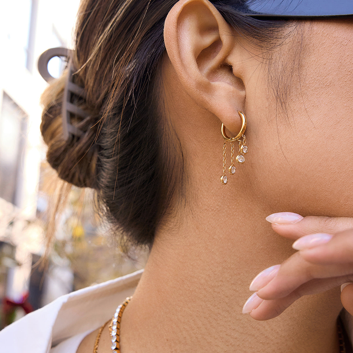 Gold stainless steel chunky hoop earrings featuring three rows of sparkling clear zirconia stone