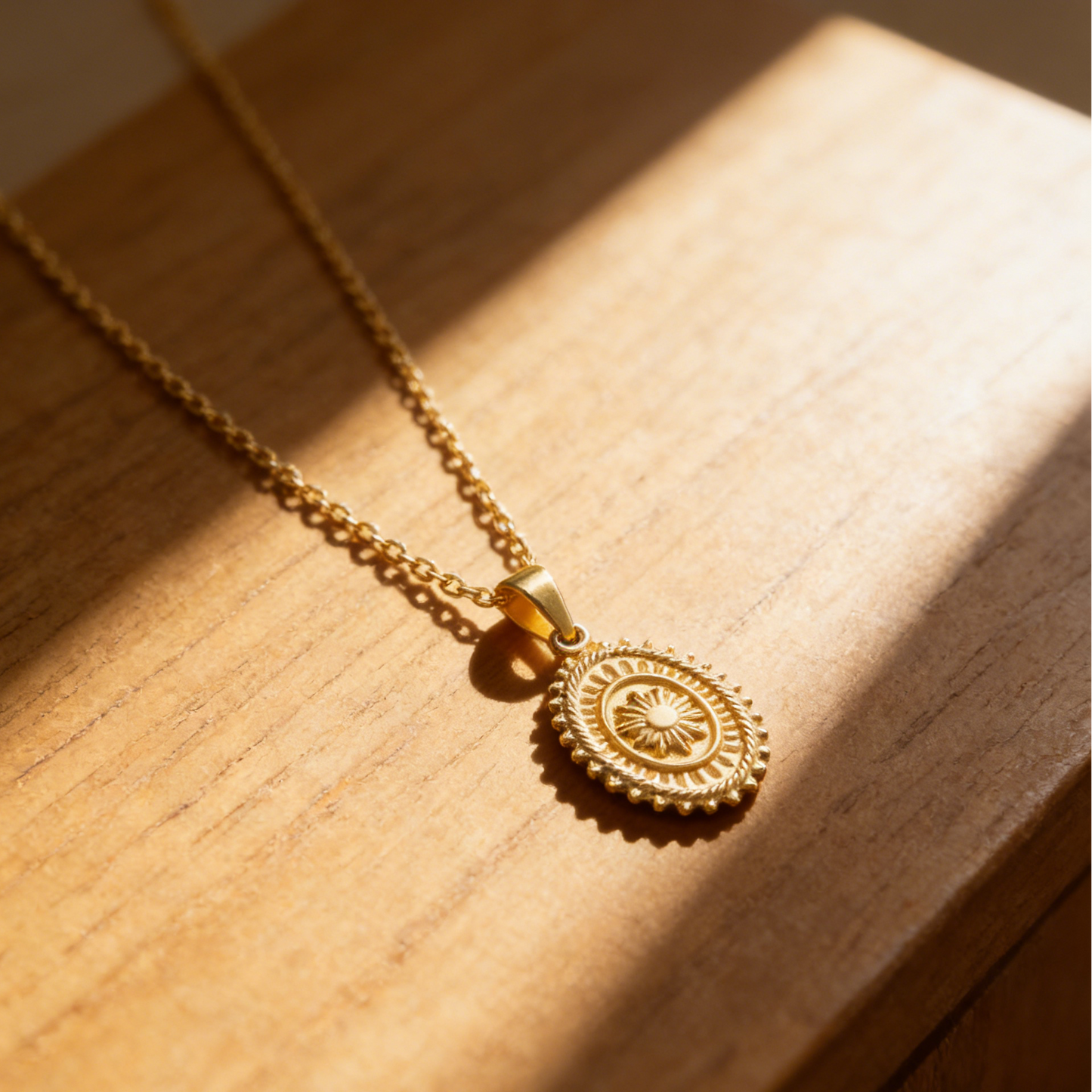 Radiant gold sun medallion pendant necklace featuring a bold sunburst design on a delicate chain for a vintage celestial look