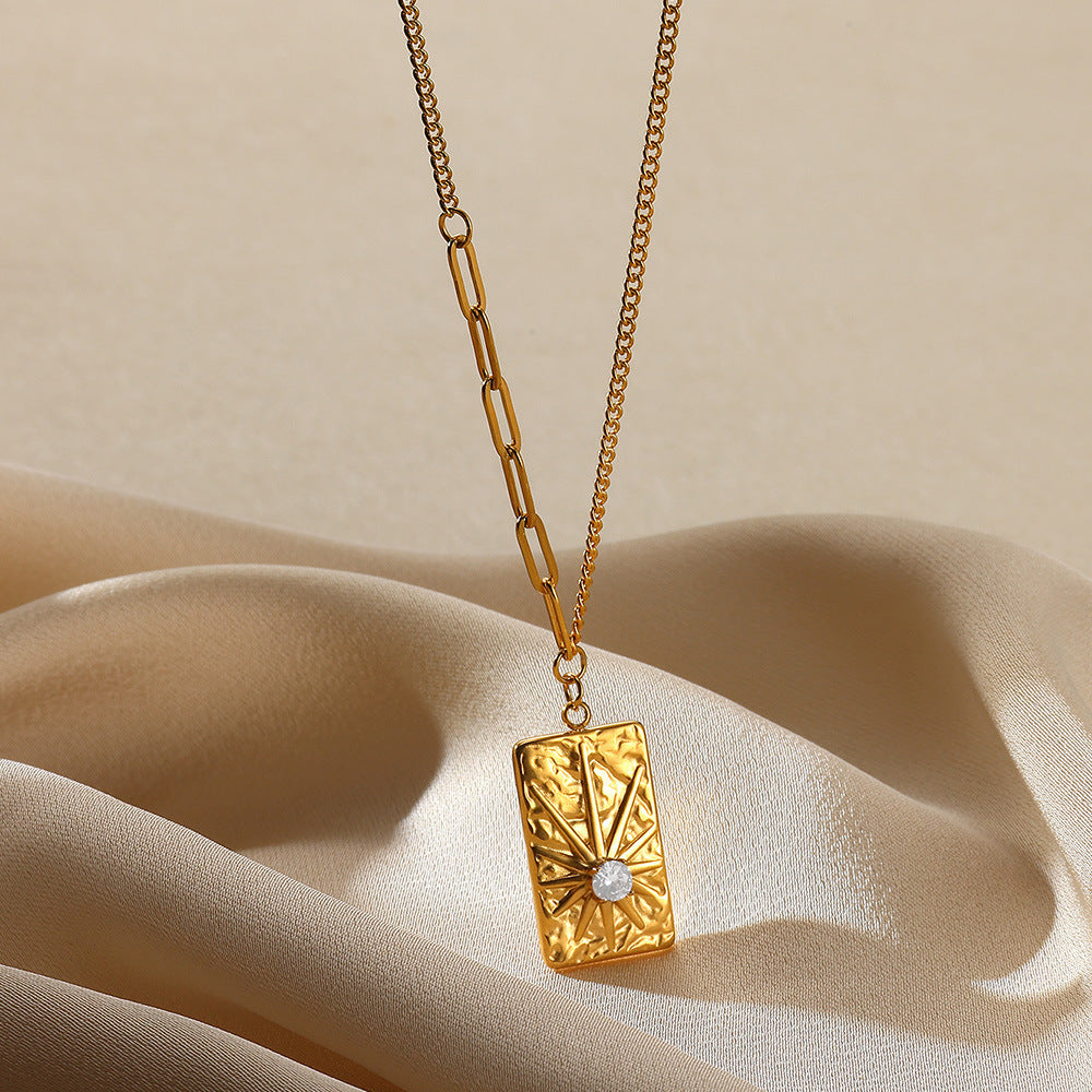 Elegant gold sunburst pendant necklace featuring a brilliant circular zircon centerpiece in a radiant celestial starburst design