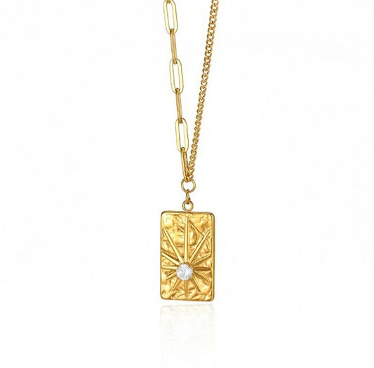 Elegant gold sunburst pendant necklace featuring a brilliant circular zircon centerpiece in a radiant celestial starburst design