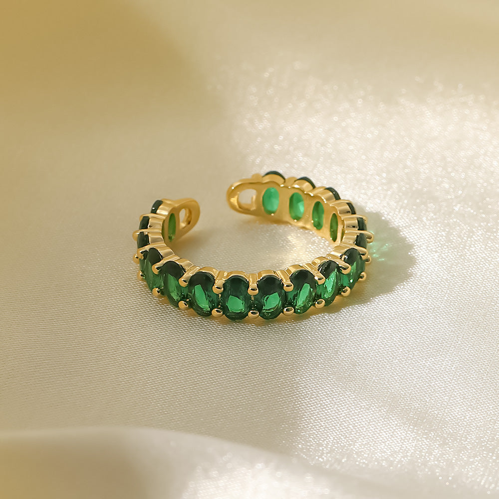 Oval emerald green cubic zirconia cz crystal eternity band open cuff adjustable ring stainless steel jewelry in waterproof 18k gold plated finish.