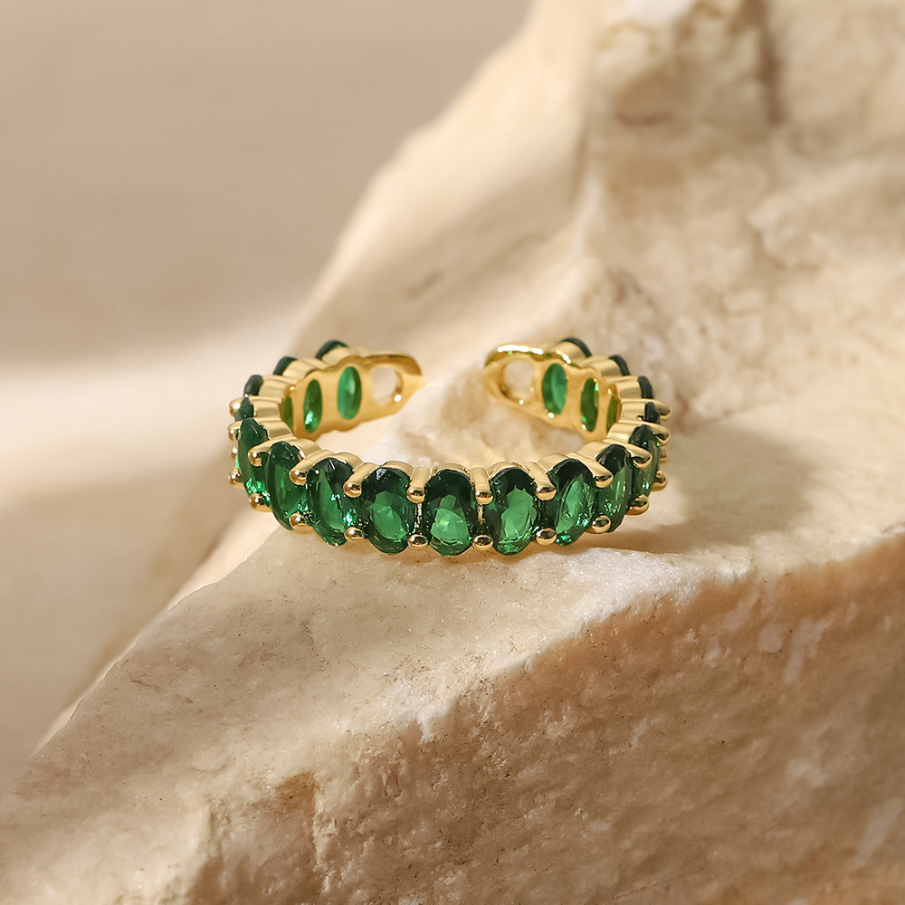 Oval emerald green cubic zirconia cz crystal eternity band open cuff adjustable ring stainless steel jewelry in waterproof 18k gold plated finish.