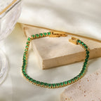 Round emerald green cubic zirconia cz crystal tennis chain bracelet stainless steel jewelry in waterproof 18k gold plated finish.