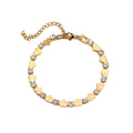 Polished gold heart and round cubic zirconia alternating tennis bracelet in 18k gold plated jewelry.
