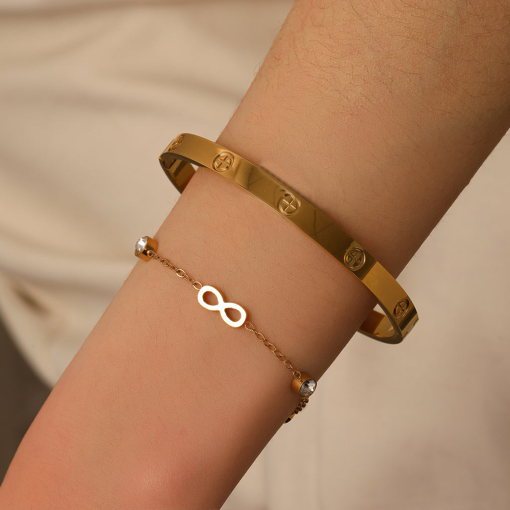 Classic engraved screw motif hinged cuff bangle in waterproof 18k gold plated stainless steel jewelry.