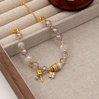 Faceted lavender crystal beaded charm Stainless steel jewelry bracelet with colorful enamel cylinder bead and CZ paved four-leaf clover charm