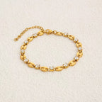 Coffee bean mariner link and round clear cubic zirconia station bracelet in 18k gold plated jewelry